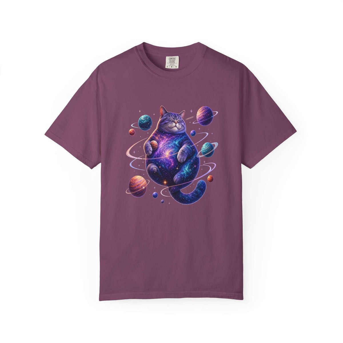 A short-sleeve crewneck t-shirt in a dusty plum purple color, featuring a colorful graphic print of a cosmic cat surrounded by planets and stars on the front. Adorable Celestial Feline: Space-Themed Cat T-Shirt for Casual Wear
