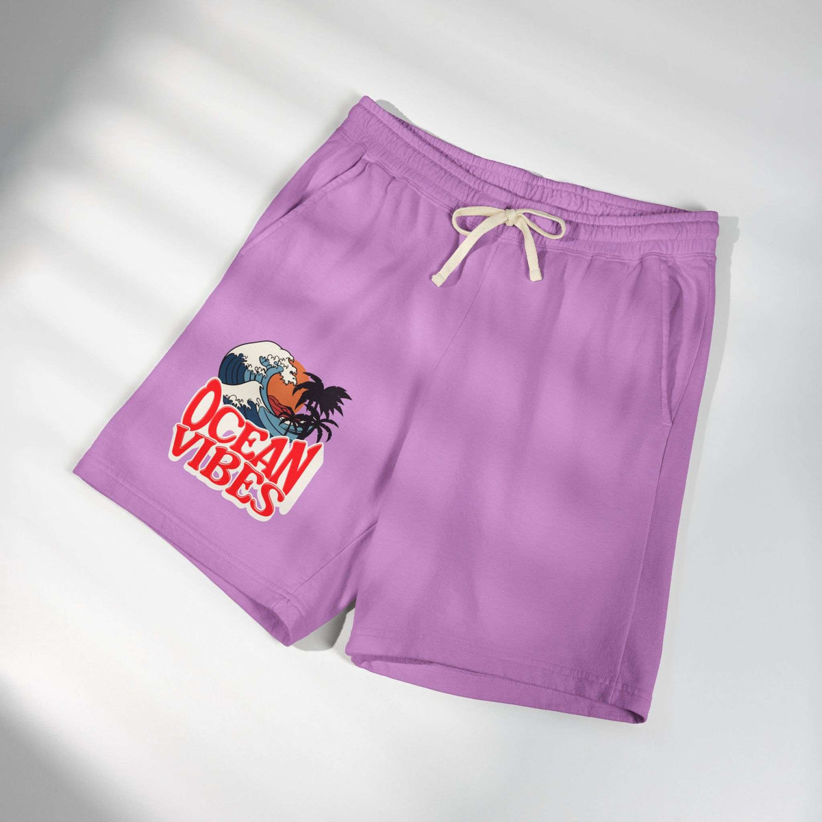 Purple athletic shorts with a cream drawstring and a graphic print on the left leg featuring a crab and the text 'OCEAN VIBES'. Unique Lightweight Fleece Sweat Shorts in Ocean Vibes Graphic Shop Lightweight Fleece Sweat Shorts in Ocean Vibes for breezy comfort, relaxed style, and an easygoing summer-ready look all day. Refresh your casual rotation with Lightweight Fleece Sweat Shorts in Ocean Vibes—soft, versatile, and ready for sunny days by the shore. Buy Lightweight Fleece Sweat Shorts in Ocean Vibes.
