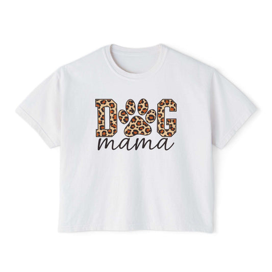 A white short-sleeve crop top t-shirt featuring a graphic print on the front that reads 'DOG mama'. The letters 'D' and 'G' are filled with a leopard print pattern, and 'mama' is written below in black cursive. Dog Mama Leopard Paw Print Women's Boxy T-Shirt Casual Wear Add playful pet-parent style to your wardrobe with the Dog Mama Leopard Paw Print Women's Boxy T-Shirt Casual Wear and its eye-catching design. Celebrate your favorite furry friend with the Dog Mama Leopard Paw Print Women's Boxy T-Shirt.
