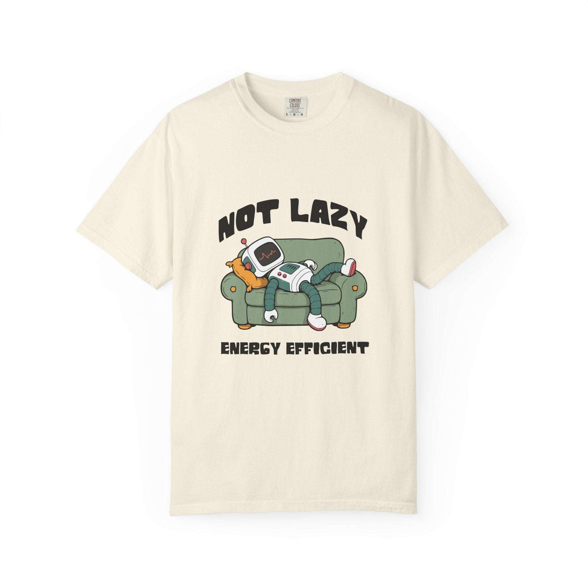 An off-white short-sleeve t-shirt with a cartoon graphic of a person lazily sleeping on a green couch with a retro television, accompanied by the text 'NOT LAZY ENERGY EFFICIENT'.