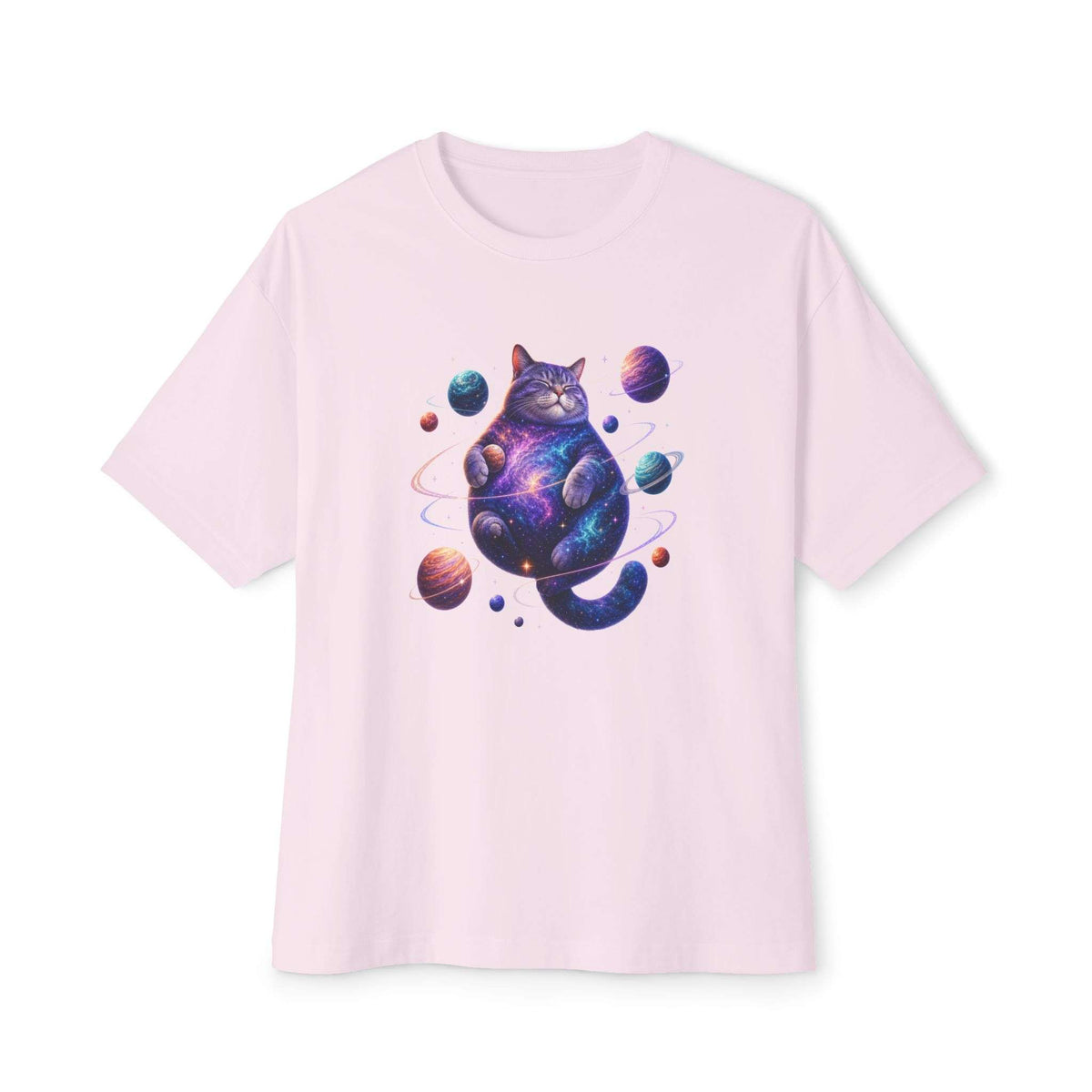 A light pink short-sleeve crewneck t-shirt featuring a colorful graphic of a cat with a galaxy print, surrounded by planets, on a solid white background. Celestial Feline Funny Cosmic Cat Unisex Oversized Boxy T-Shirt Casual Wear