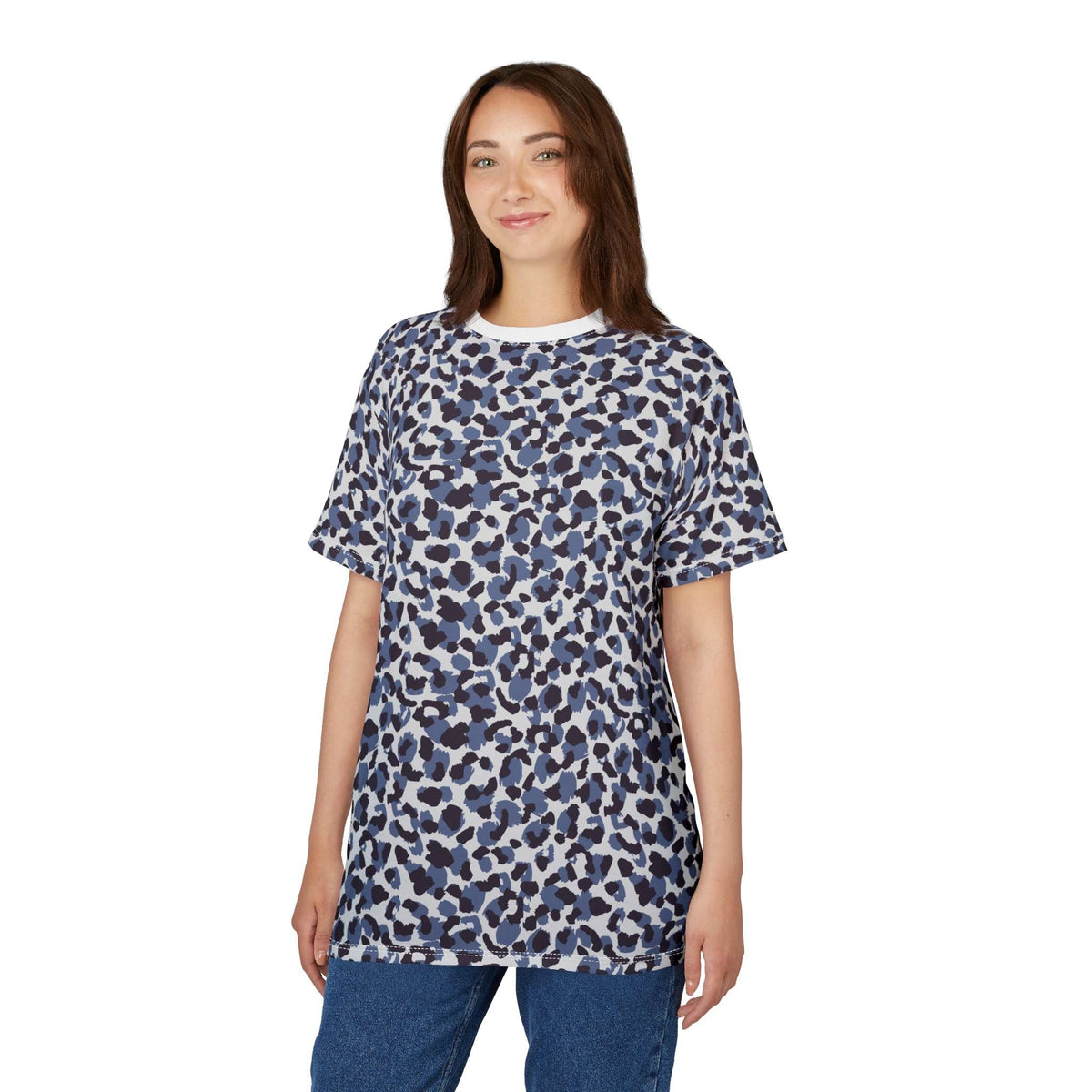 A woman modeling a short-sleeve crewneck t-shirt with a blue, navy, and white abstract organic pattern, paired with blue jeans against a solid white background. Comfortable Bold Blue Leopard Print T-Shirt for Casual Wear