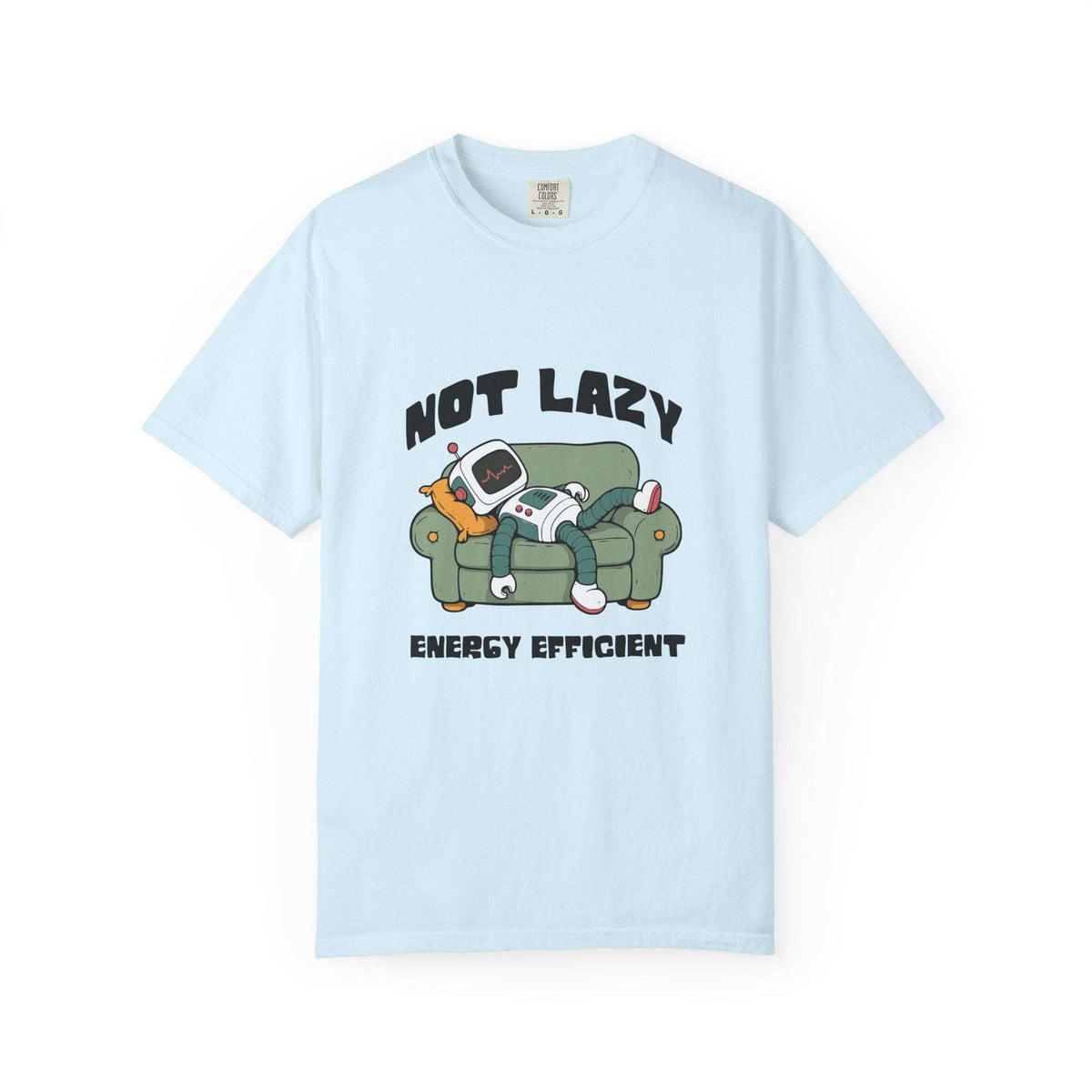 A light blue short-sleeve t-shirt with a graphic print on the front. The graphic features the text 'NOT LAZY' above an illustration of a person in a green room with a retro computer and cat, and 'ENERGY EFFICIENT' below.