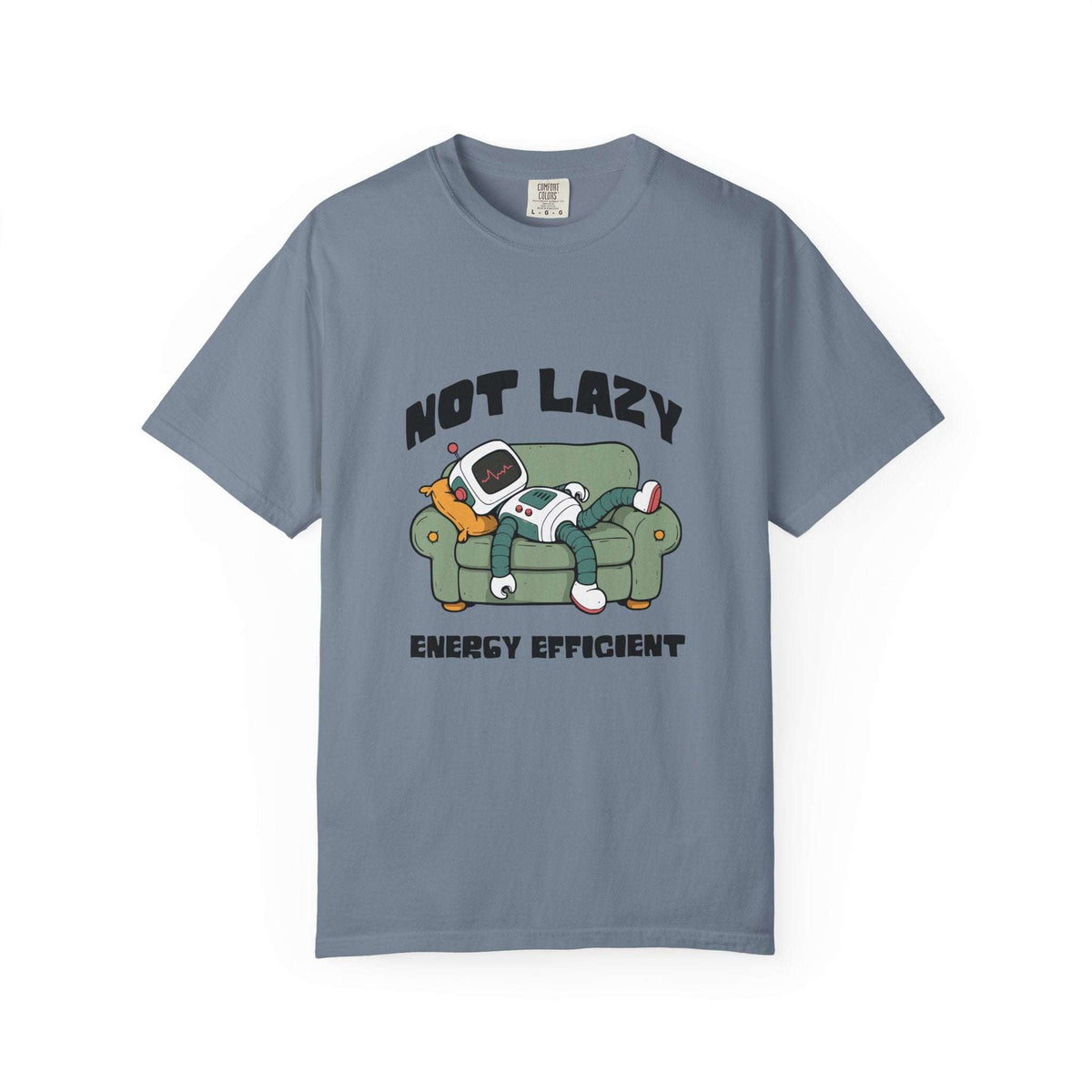 A slate blue crewneck t-shirt featuring a cartoon graphic of a person lazily reclining on a green couch with a retro television, with the text 'NOT LAZY ENERGY EFFICIENT' printed in black.