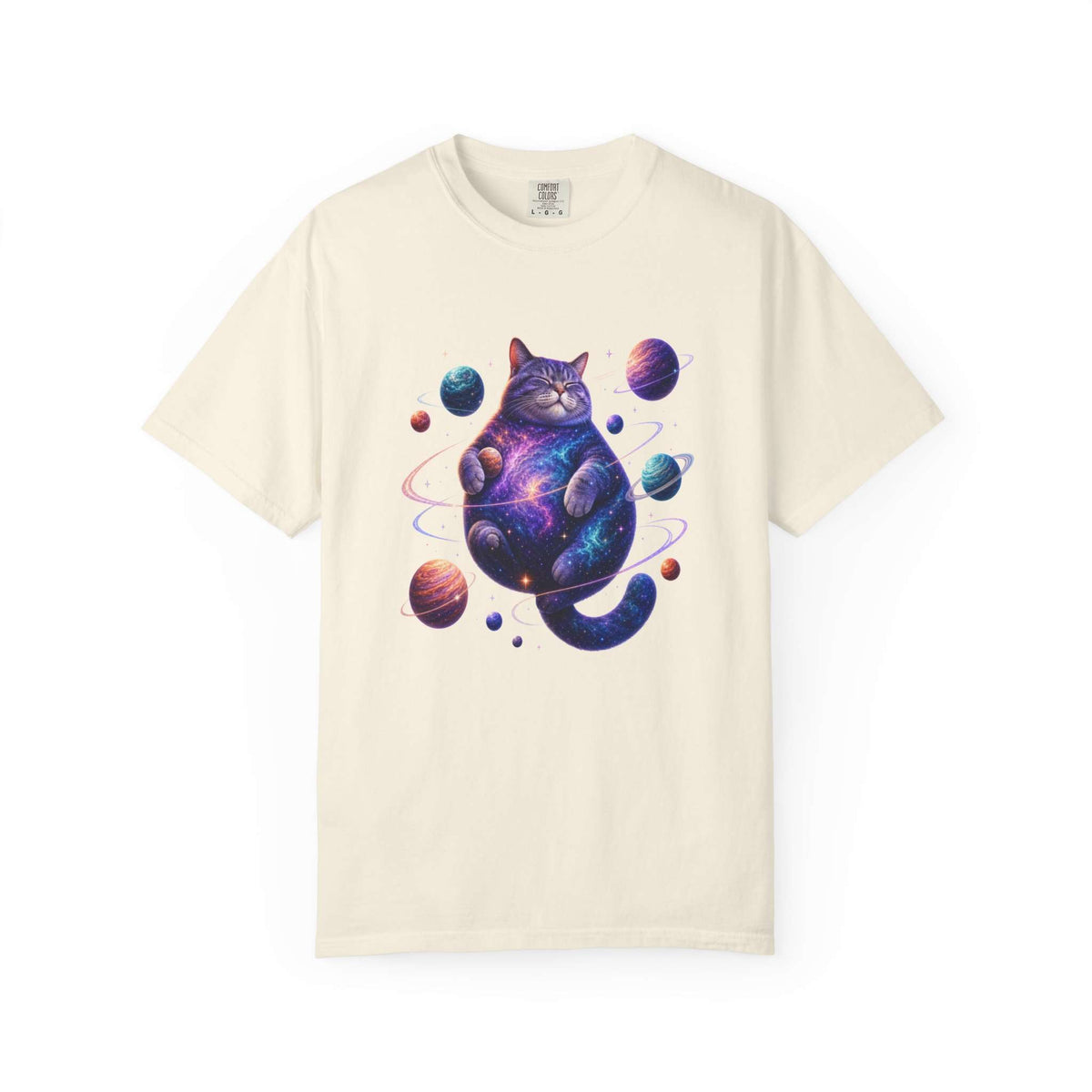 An off-white short-sleeve crewneck t-shirt featuring a colorful graphic of a cosmic, galaxy-patterned cat sitting among planets. Cute Celestial Feline: Space-Themed Cat T-Shirt for Casual Wear