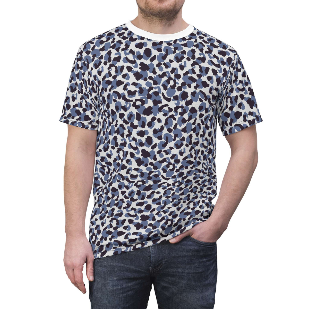 A man wearing a short-sleeve crewneck t-shirt with a blue, gray, and black leopard print pattern on a white base, paired with dark blue jeans, against a plain white background. Elegant Bold Blue Leopard Print T-Shirt for Casual Wear