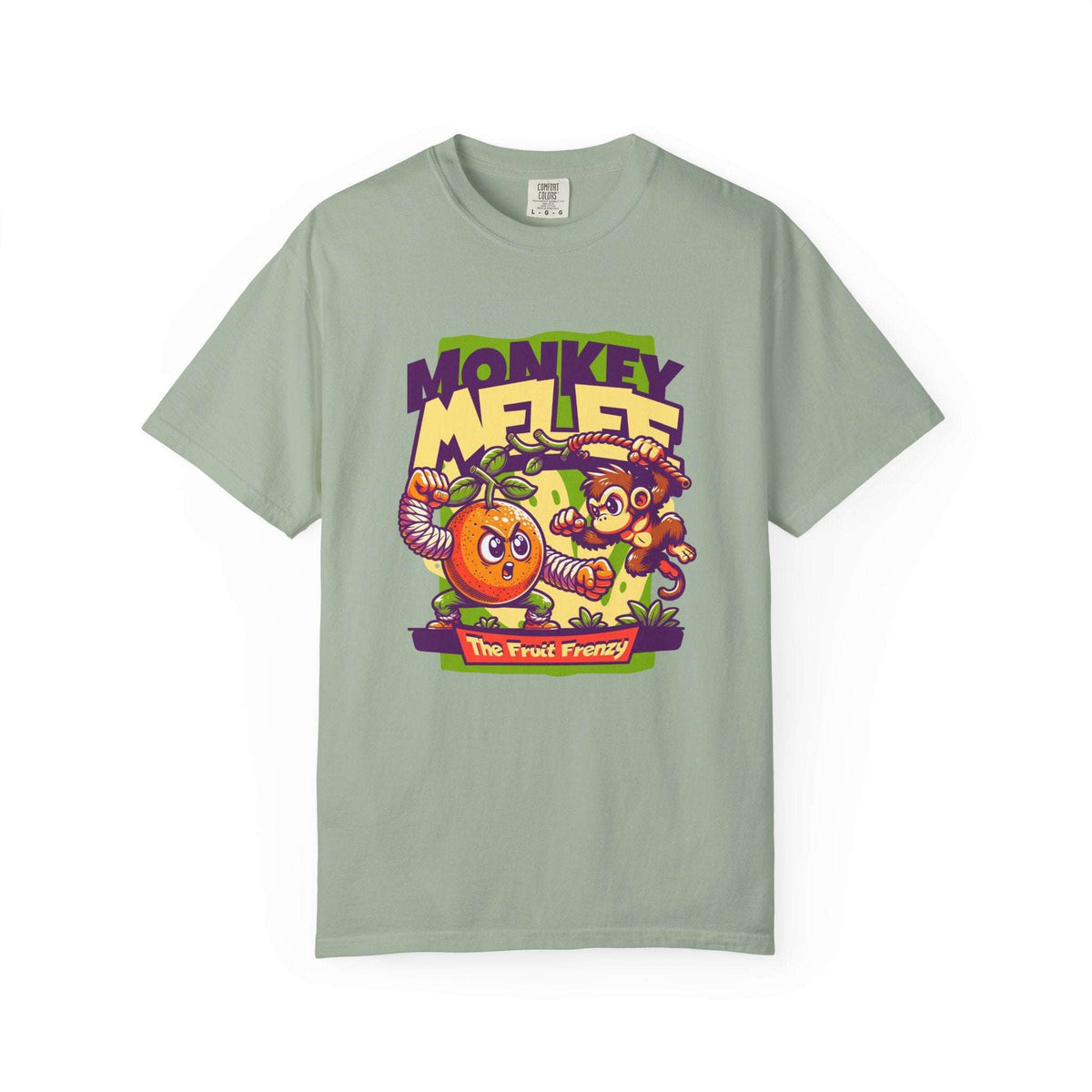 A sage green crewneck t-shirt featuring a colorful graphic print of a cartoon monkey and an orange with the text 'MONKEY MELEE The Fruit Fantasy'. Fun Monkey Melee The Fruit Frenzy Graphic T-Shirt for Casual Wear