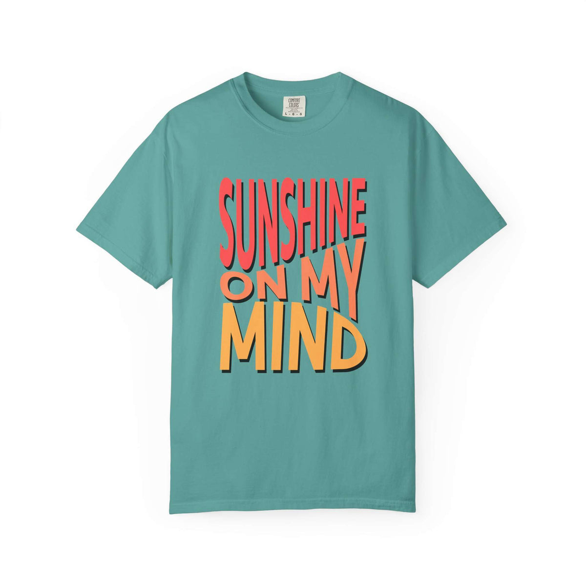A teal short-sleeve t-shirt with a retro-style graphic text reading 'SUNSHINE ON MY MIND' in coral red and orange-yellow with black drop shadows, displayed on a clean white background. Modern Sunshine On My Mind Summer Vibes Graphic T-Shirt Casual Wear