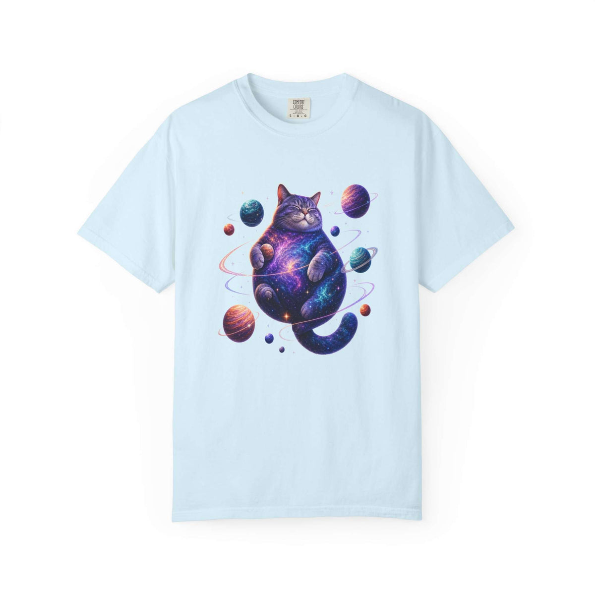 A light blue short-sleeve crewneck t-shirt featuring a colorful graphic of a cosmic, galaxy-patterned cat surrounded by planets, displayed on a clean white background. Out-of-This-World Celestial Feline: Space-Themed Cat T-Shirt for Casual Wear