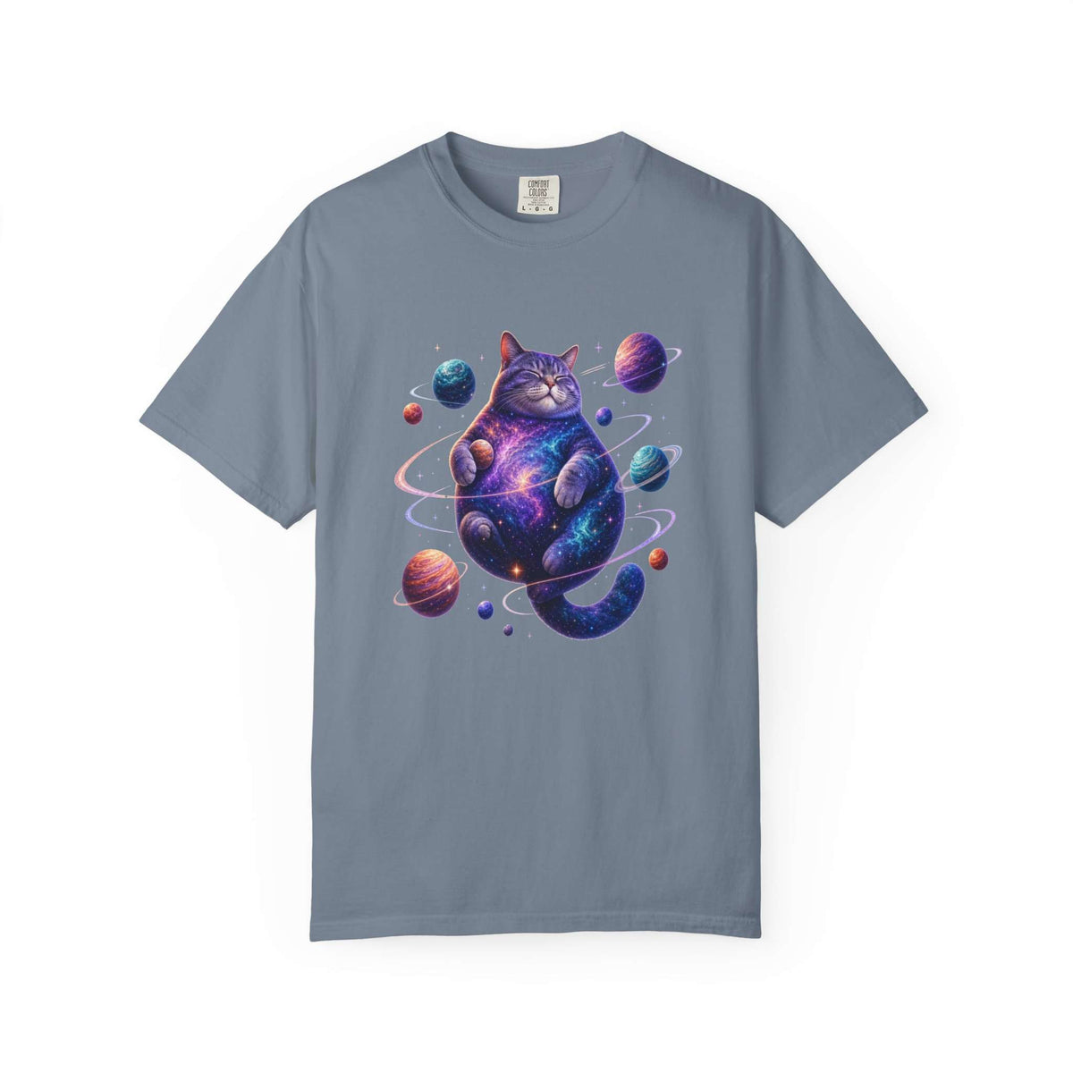 A slate blue crewneck t-shirt featuring a colorful graphic of a cosmic purple cat surrounded by planets, displayed on a clean white background. Playful Celestial Feline: Space-Themed Cat T-Shirt for Casual Wear