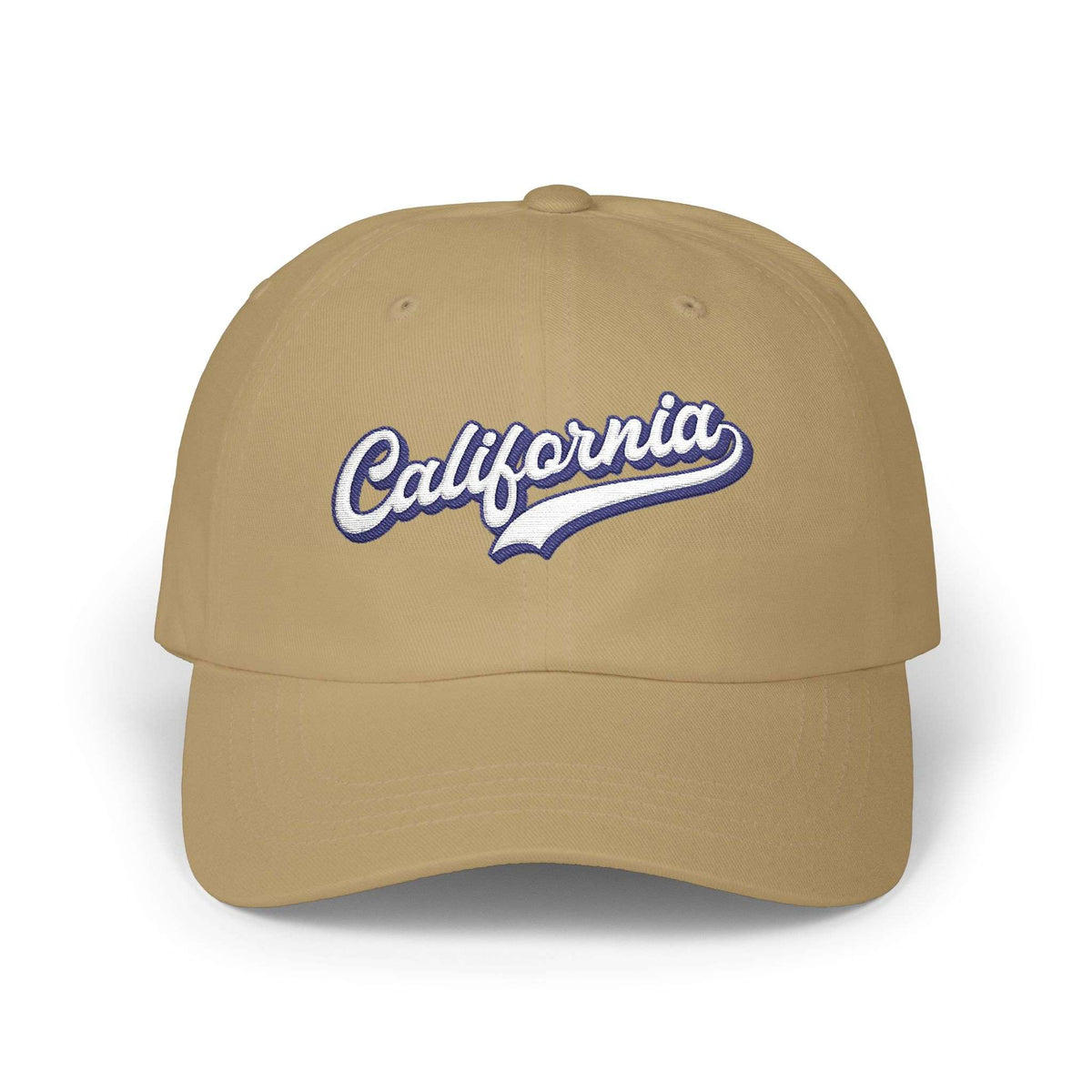 A tan baseball cap featuring 'California' embroidered in white script with a blue outline on the front, set against a plain white background. Retro California Typography Embroidered Classic Dad Cap