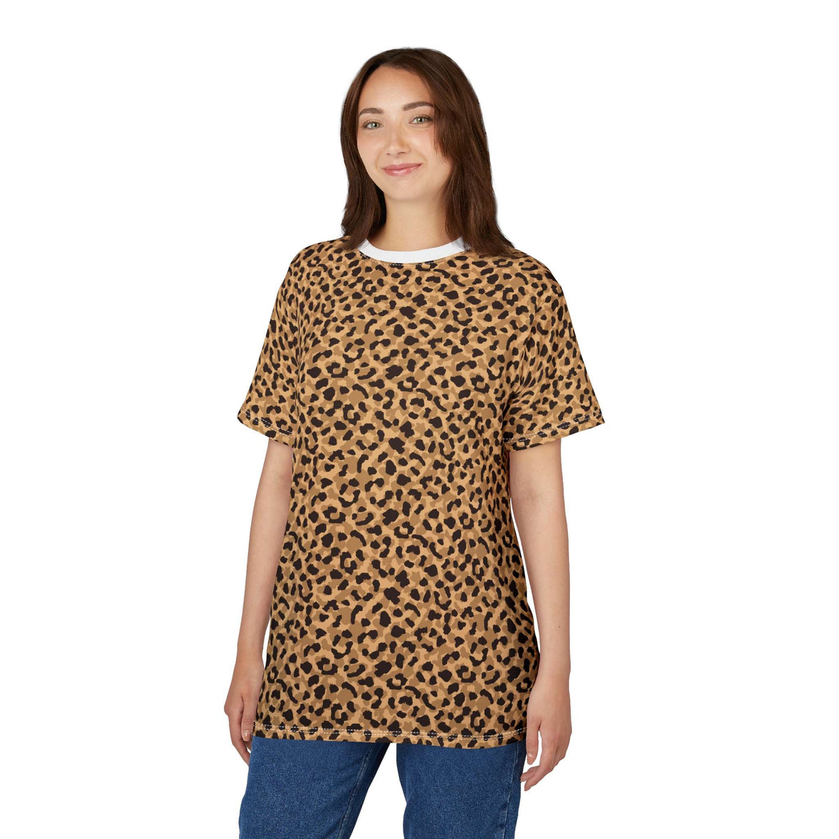 A woman modeling a short-sleeve crewneck t-shirt with a tan and black leopard print pattern, paired with blue jeans, against a plain white background. Unique Bold Brown Leopard Print T-Shirt for Casual Wear