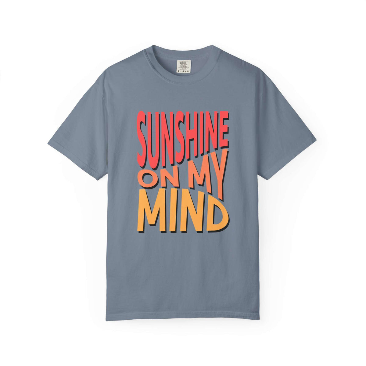 A slate blue short-sleeve t-shirt with a bold graphic text print reading 'SUNSHINE ON MY MIND' in red and orange 3D-style lettering, displayed on a clean white background. Unique Sunshine On My Mind Summer Vibes Graphic T-Shirt for Casual Wear