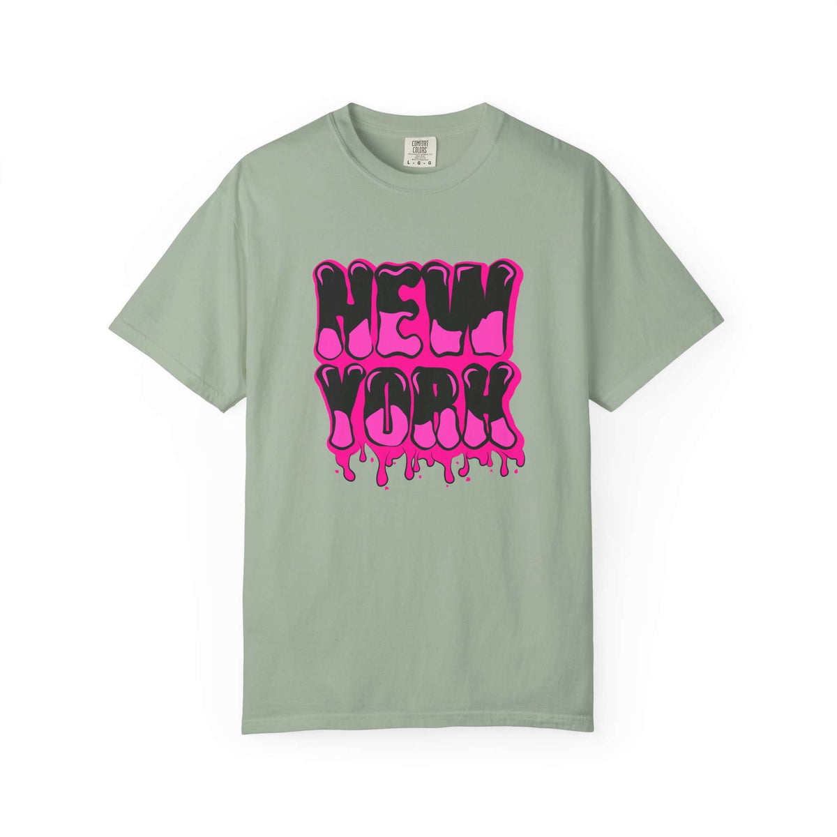 A sage green short-sleeve t-shirt with a vibrant pink and black dripping 'NEW YORK' graphic on the front, displayed against a clean white background. Vintage Bold Graffiti Lettering New York Typography T-Shirt for Casual Wear