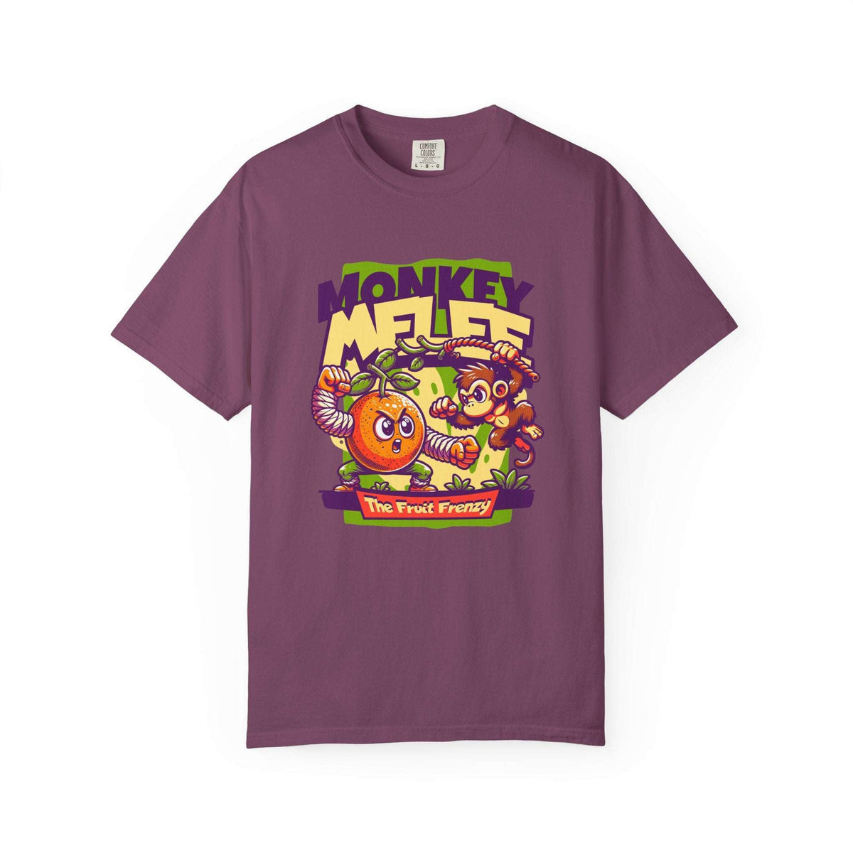 A purple short-sleeve crewneck t-shirt featuring a colorful cartoon graphic on the front with the text 'MONKEY MELEE' and 'The Fruit Frenzy' depicting a monkey, a banana, and a pineapple. Wild Fruit Frenzy: Monkey-Themed T-Shirt Design
